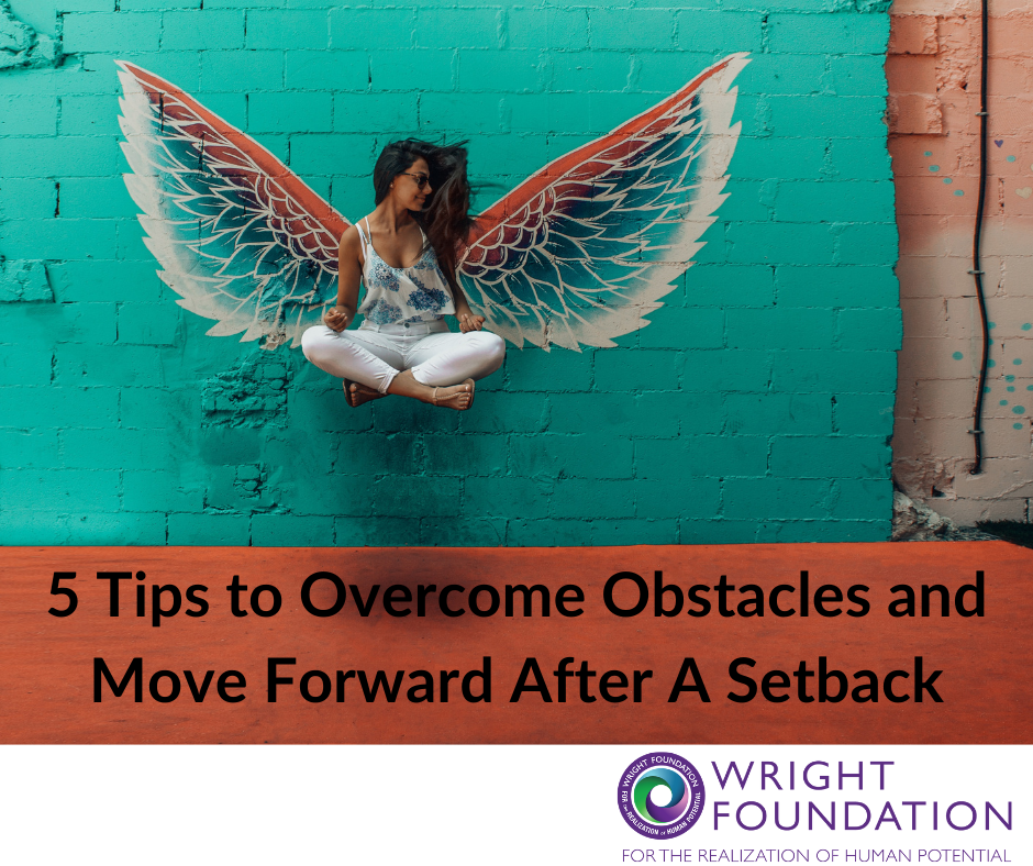 A woman poses with bird wings. Tips for overcoming obstacles and move forward. 